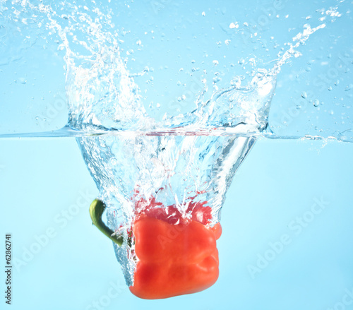 red pepper splashed into water