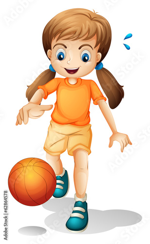A young girl playing basketball