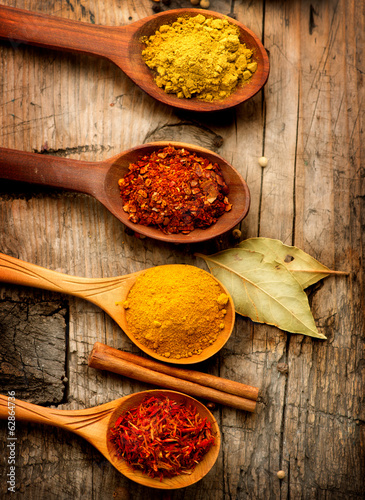 Fototapeta Naklejka Na Ścianę i Meble -  Various spices and herbs over wooden background