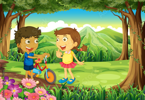 A forest with kids and a bike