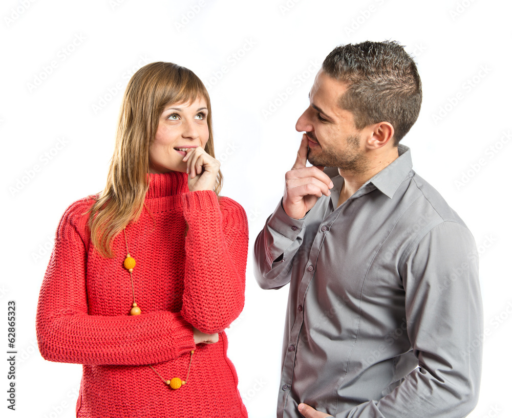 Couple thinking over isolated white background