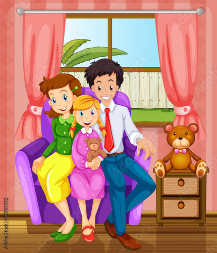 A smiling family inside the house