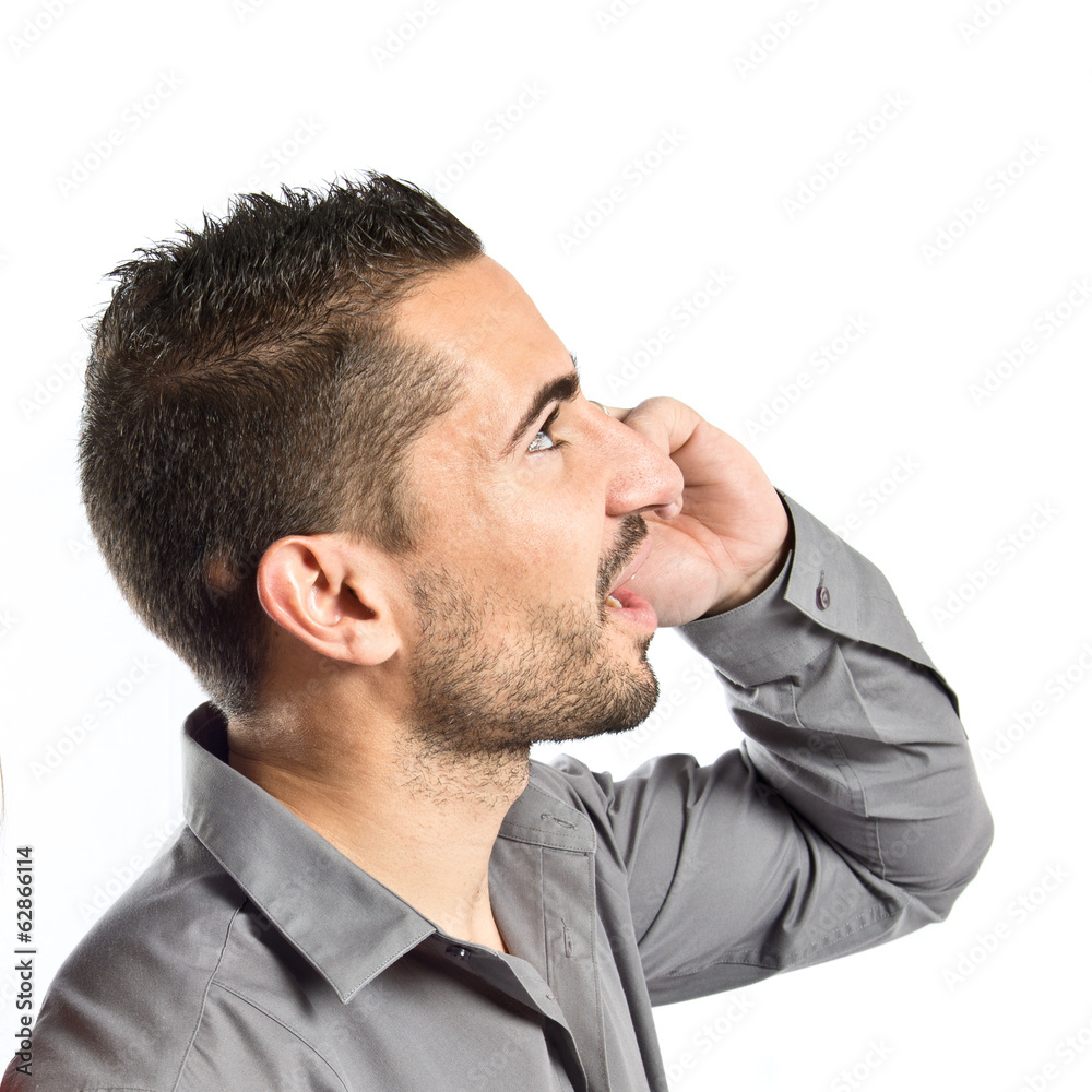 Fototapeta premium Men talking to mobile over isolated background.