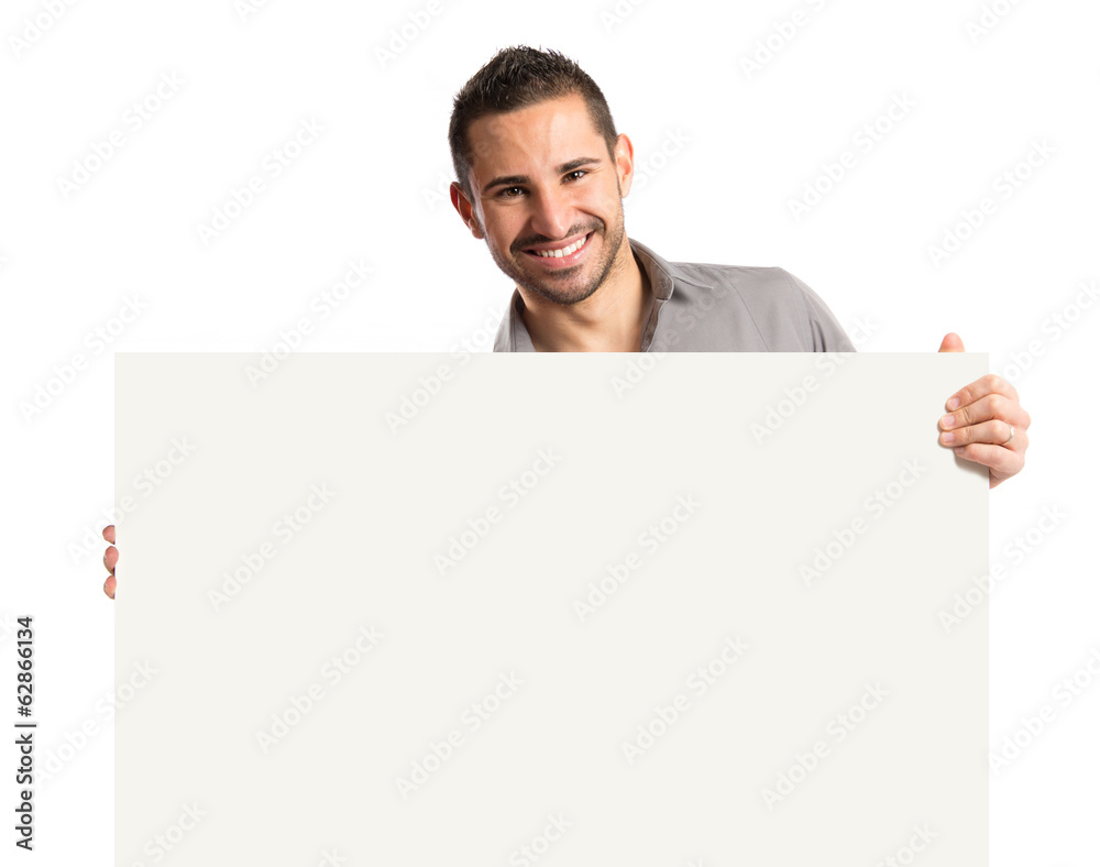 handsome man holding an empty cardboard over white background handsome man holding an empty cardboard over white background