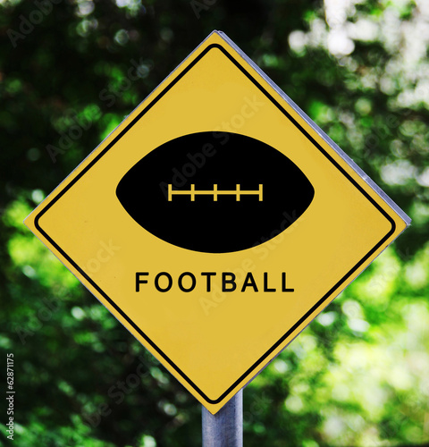 Yellow traffic label with american football ball pictogram photo