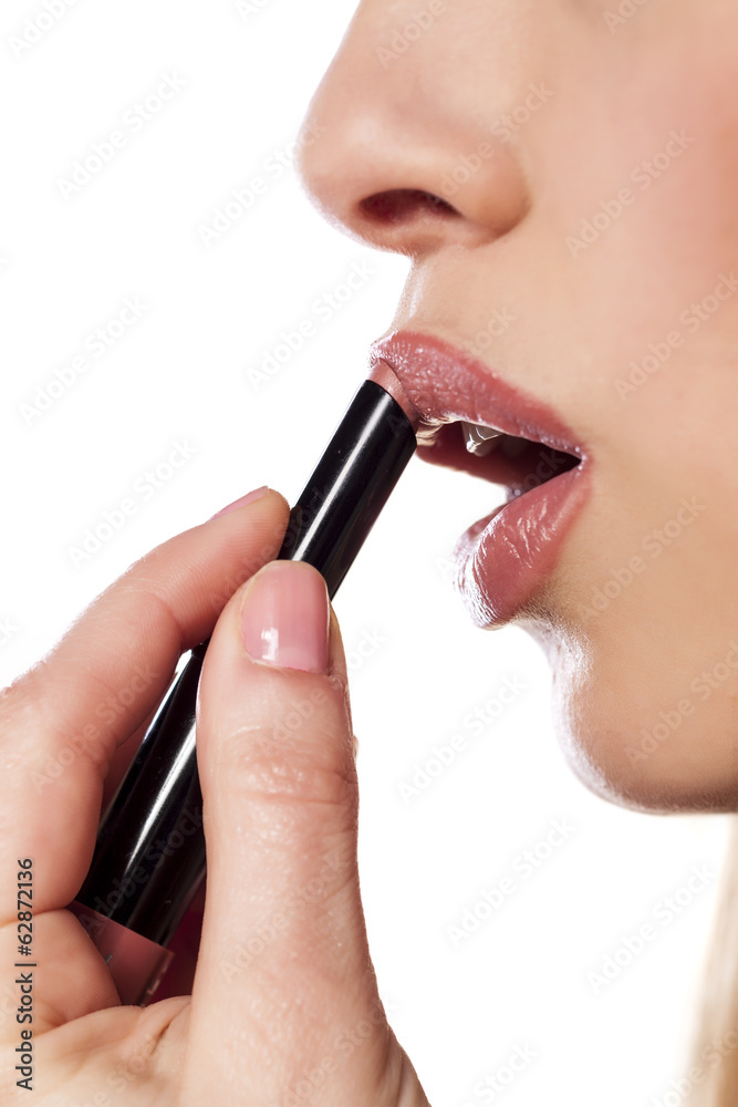 close up on a woman who applied lipstick