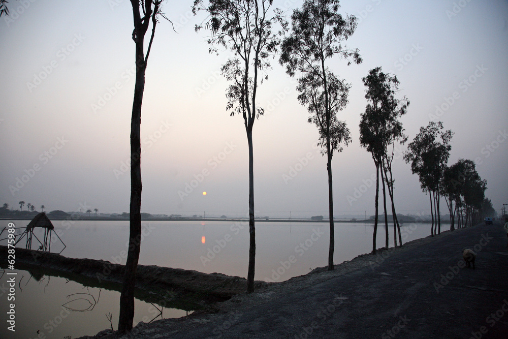 Sunset on holiest river in India. Ganges delta in Sundarbans Sunset on holiest river in India. Ganges delta in Sundarbans