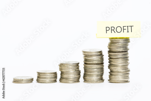 Isolated coins stacked with profit label on top