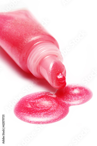 lip gloss pink color from tube on white background