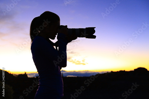 Photographer taking pictures with SLR camera