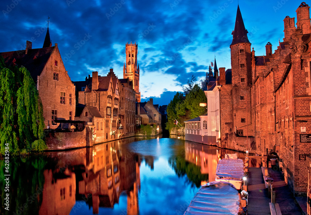 Historic medieval buildings along a canal in Bruges, Belgium Historic medieval buildings along a canal in Bruges, Belgium