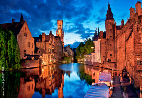 Historic medieval buildings along a canal in Bruges, Belgium