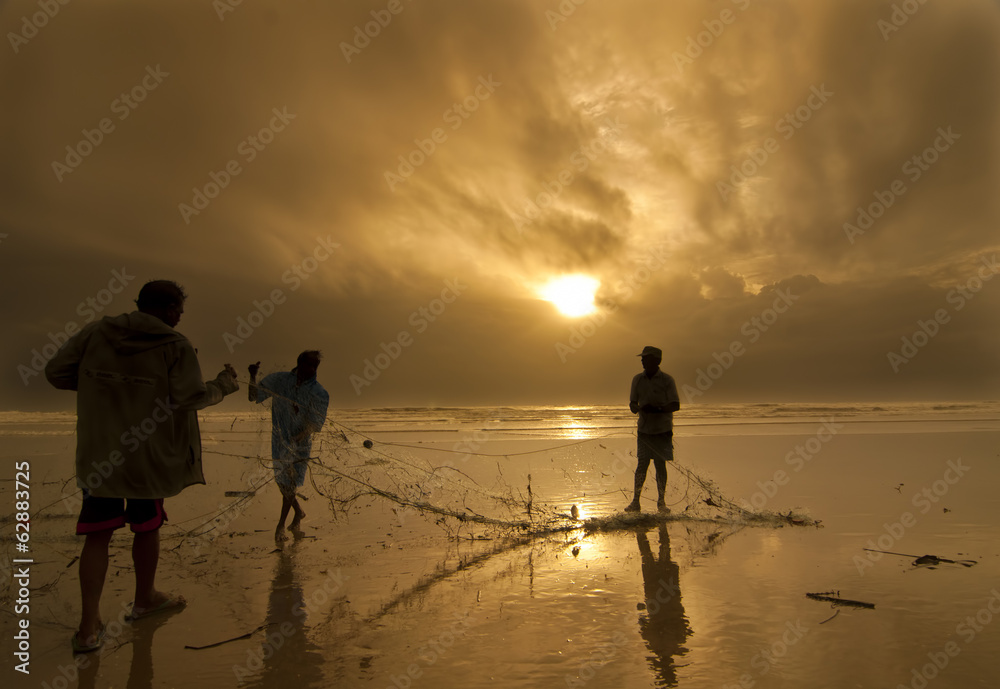 Fototapeta premium Fishermen working together in Goa, India
