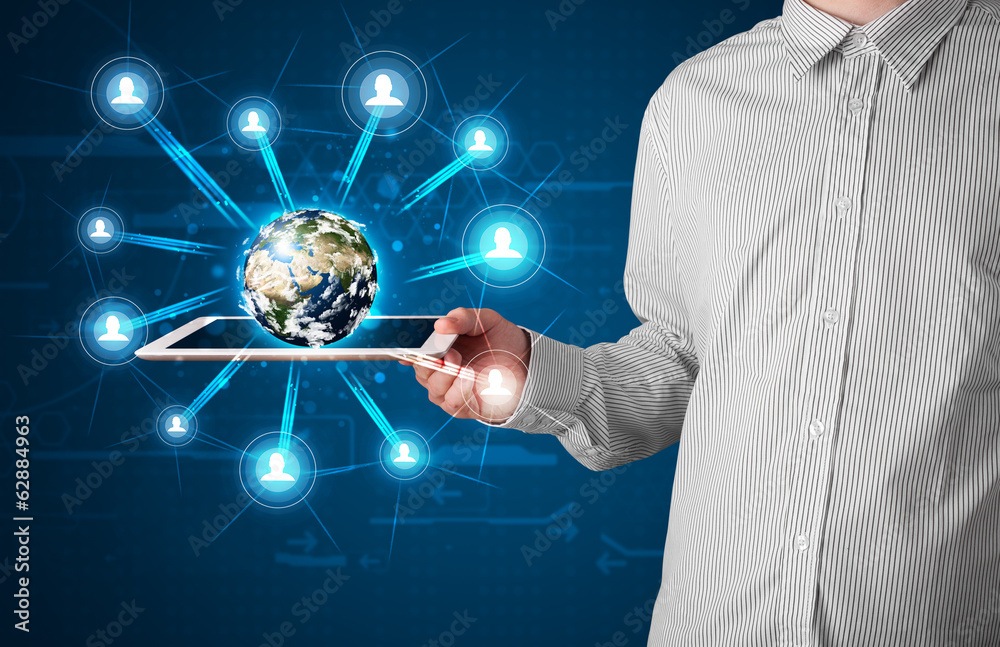 Businessman presenting 3d earth globe in tablet Businessman presenting 3d earth globe in tablet