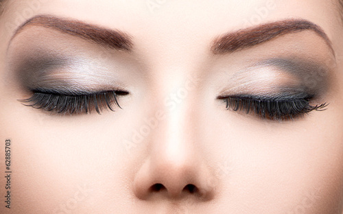Beauty eyes makeup closeup. Long eyelashes, perfect skin