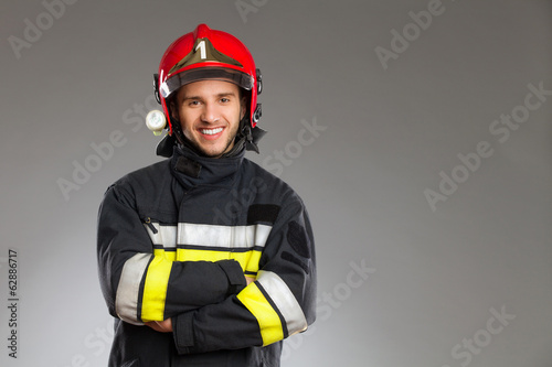 Fireman posing wth arms crossed.