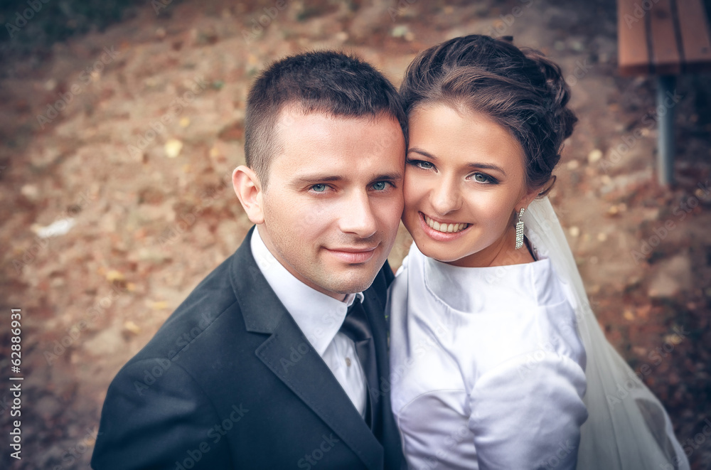 Wedding shot of bride and groom in park Wedding shot of bride and groom in park