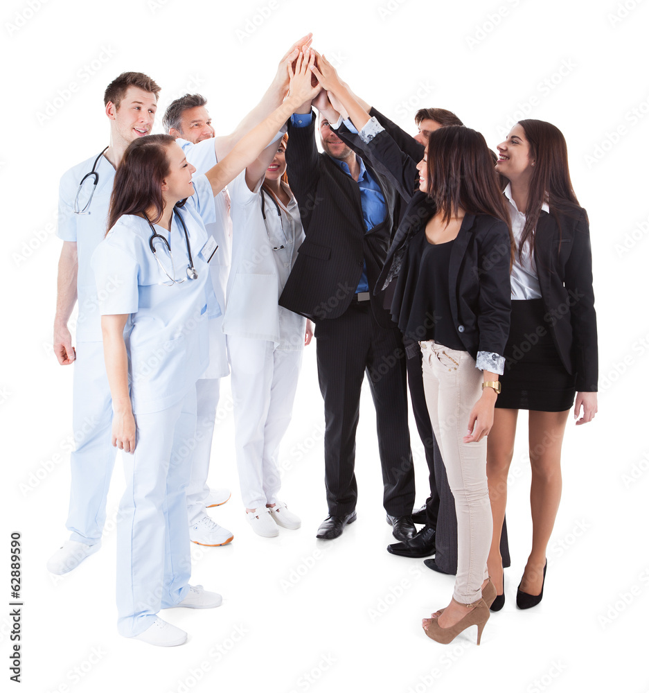 Doctors and managers making high five gesture Doctors and managers making high five gesture