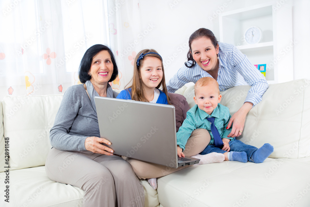 Grandmother, mother, daughter and son using laptop at home. Grandmother, mother, daughter and son using laptop at home.