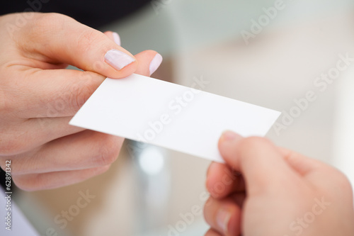 Businesspeople Exchanging Visiting Card