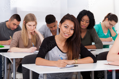 Female college student sitting at desk