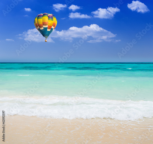 Colorful hot air balloon over the beach