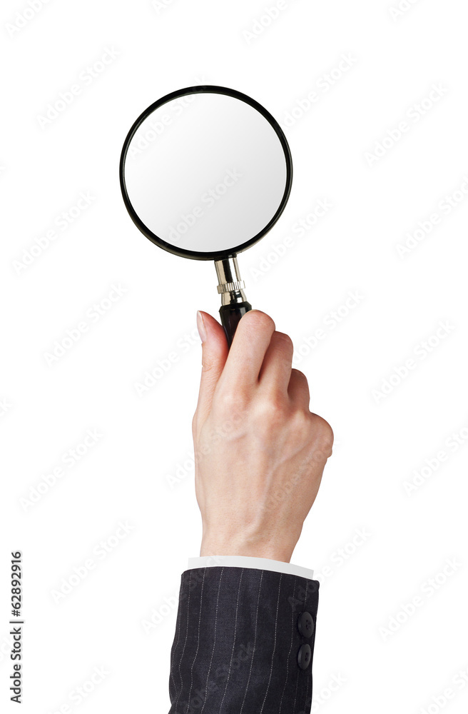 Magnifier glass in woman hand isolated on white Magnifier glass in woman hand isolated on white