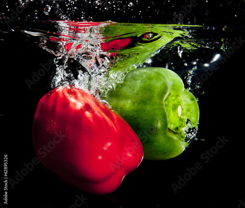 Peppers Splashing Into Water