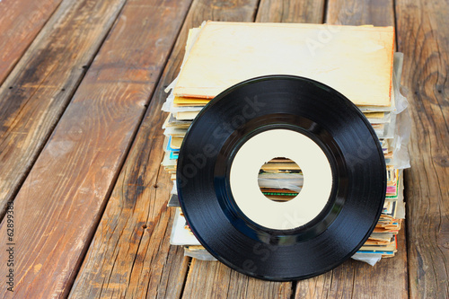 close up of old record and records stack photo