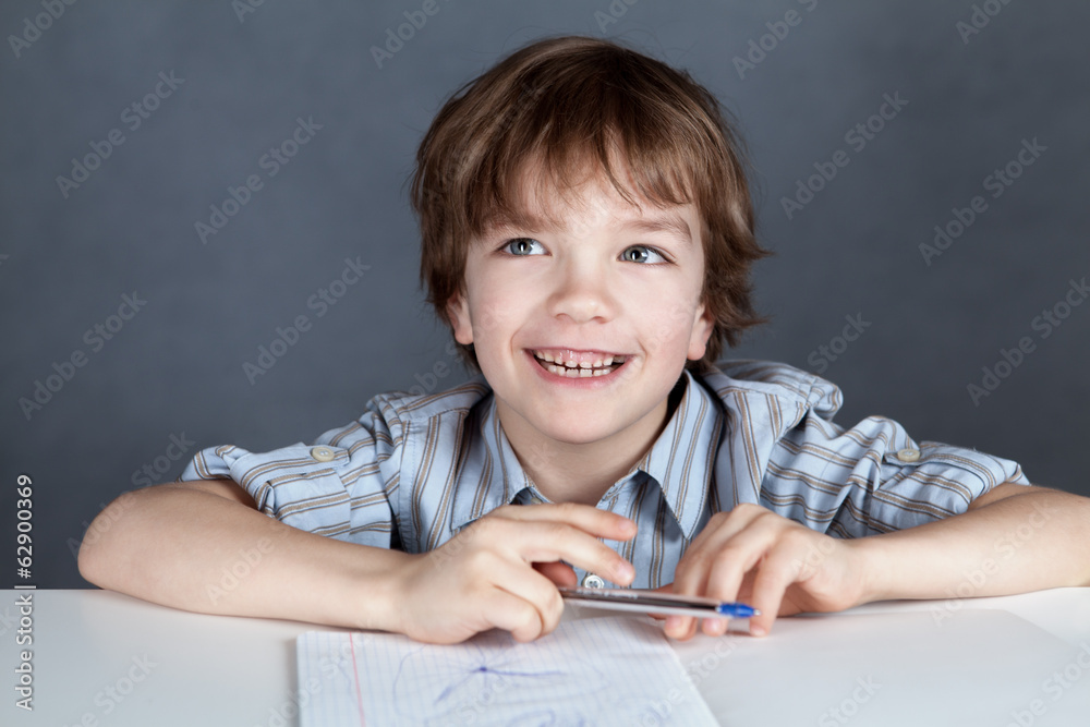 Happy student sitting at desk Happy student sitting at desk