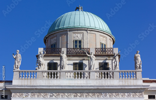 Detail of the facade and the dome of the Carciotti palace in Trieste, Italy photo