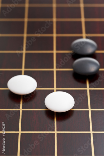 black and white stones during go game photo