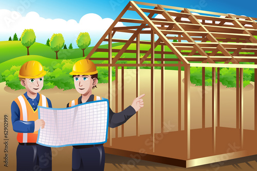 Construction worker discussing blueprint