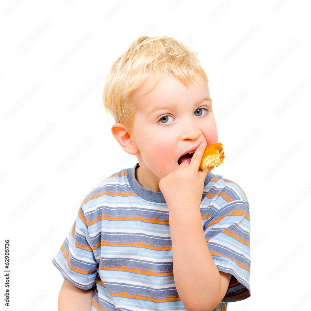 Cute little boy eating delicious cookie isolated on white Cute little boy eating delicious cookie isolated on white