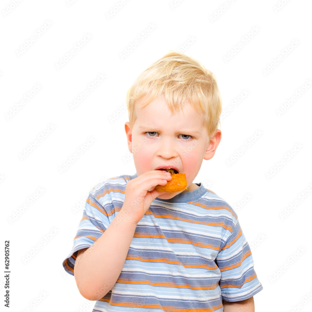 Cute little boy eating delicious cookie isolated on white Cute little boy eating delicious cookie isolated on white
