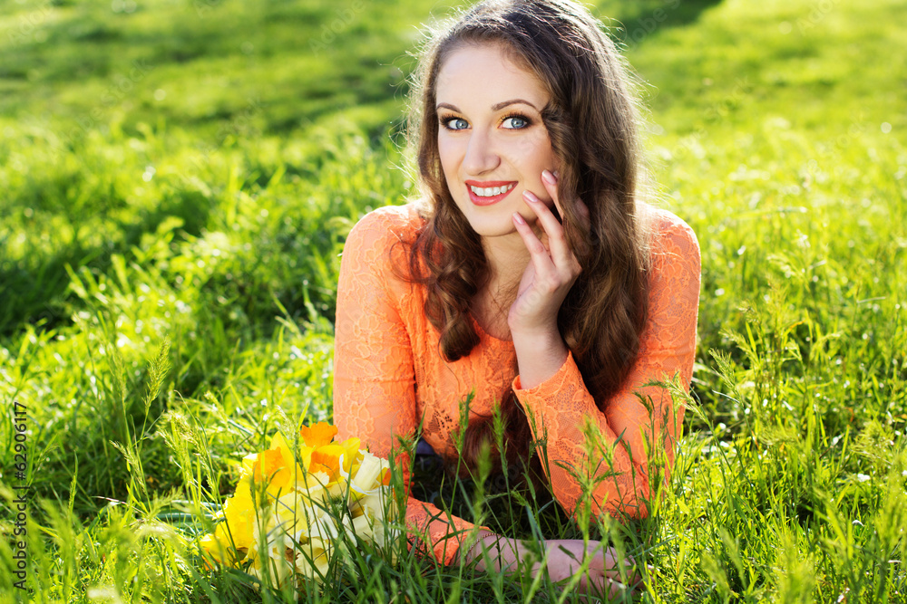 Happy smiling girl with yellow flowers Happy smiling girl with yellow flowers