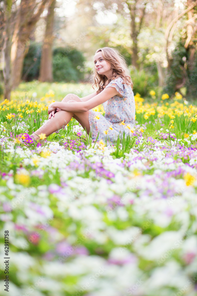 Beautiful young girl in forest on a spring day