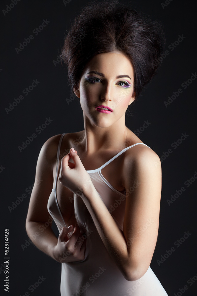 Naklejka premium Sexy model in erotic negligee posing at camera