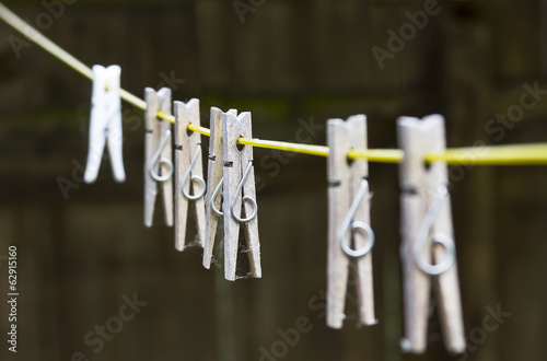 set of wooden pegs on washing line