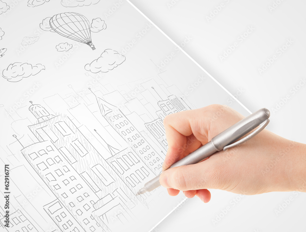 A person drawing sketch of a city with balloons and clouds on a A person drawing sketch of a city with balloons and clouds on a