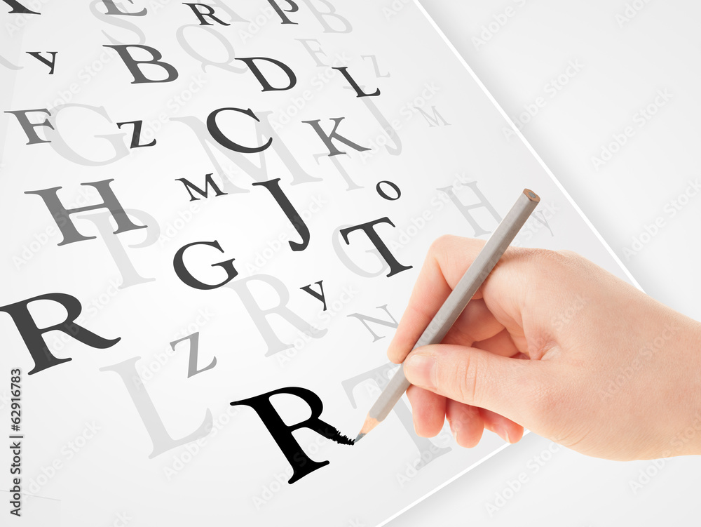 Hand writing various letters on white plain paper Hand writing various letters on white plain paper