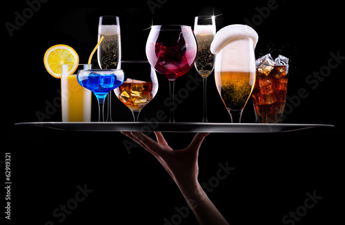 different alcohol drinks set on a tray