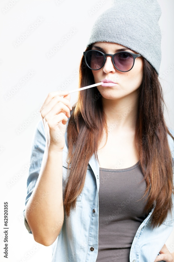 Hipster teenage girl smoking cigarette Stock Photo | Adobe Stock