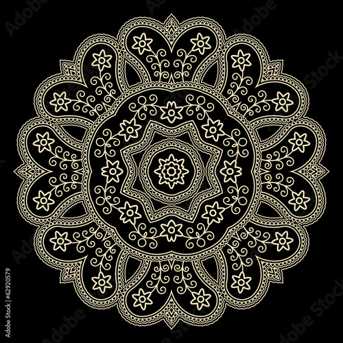 Gold lace doily on black, round crochet ornament