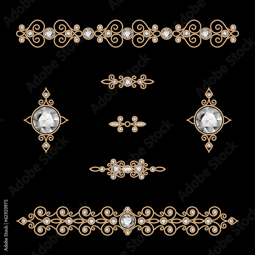 Set of vintage gold jewelry dividers on black