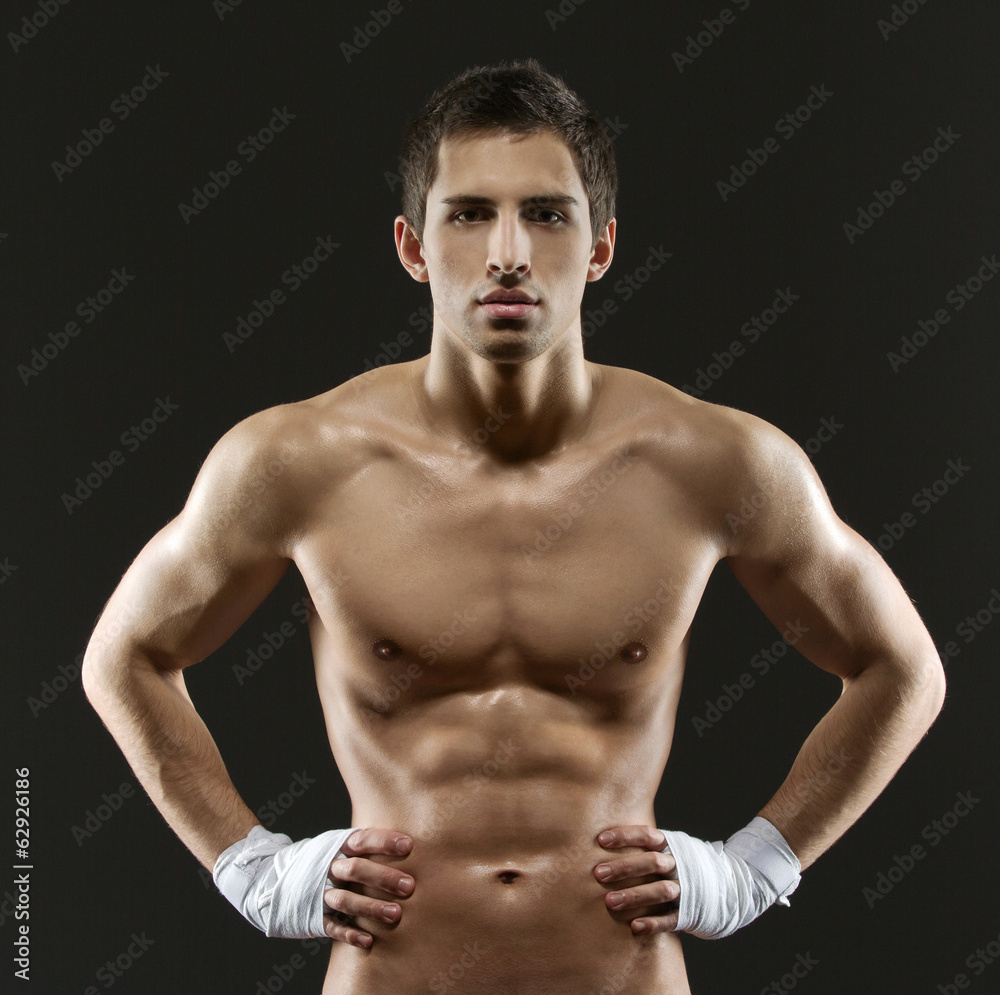 Half-length portrait of nude boxer with hands on hips Half-length portrait of nude boxer with hands on hips