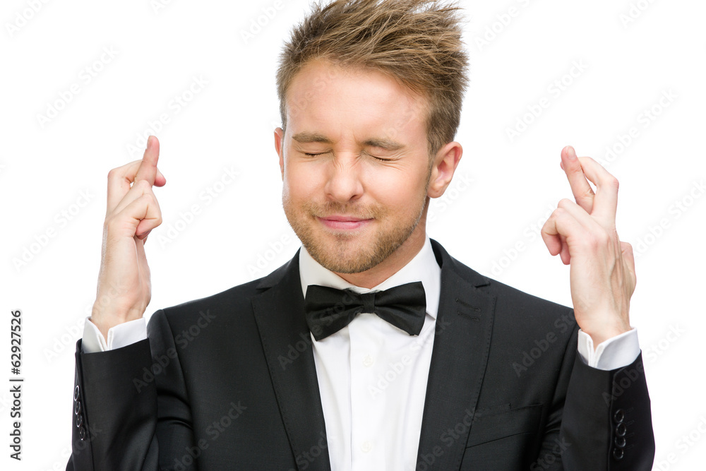 Half-length portrait of manager with fingers crossed Half-length portrait of manager with fingers crossed