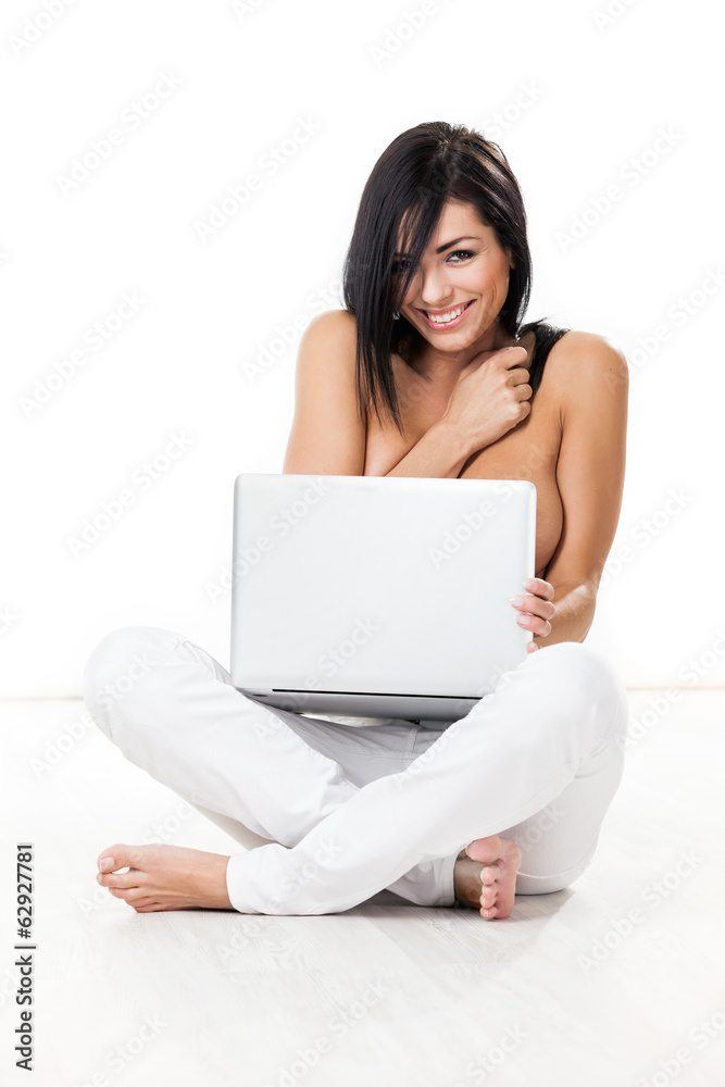 nice topless woman sitting on white flooring with laptop or note nice topless woman sitting on white flooring with laptop or note