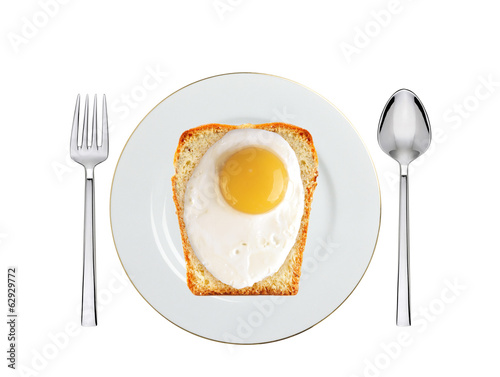 Scrambled eggs with bread on plate isolated on white