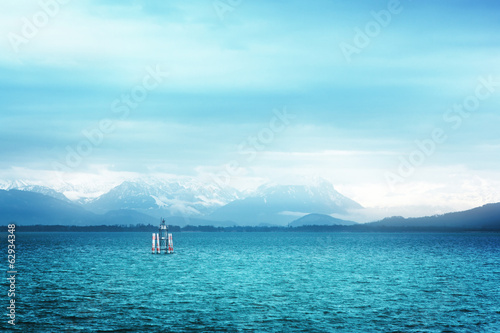Surreal view of Bodensee with the Alps in the background
